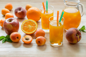 Apricot peach apple orange juice with ice.