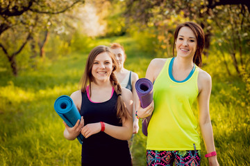 Young girls yoga in the park.