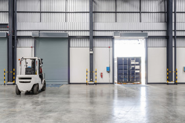 Forklift and contianer in the warehouse