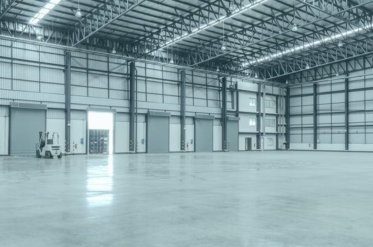 Shutter Door Inside Factory And Empty Warehouses.