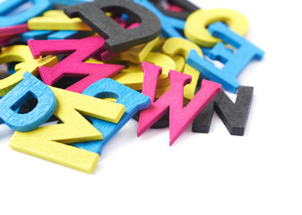 Pile of painted wooden letters isolated