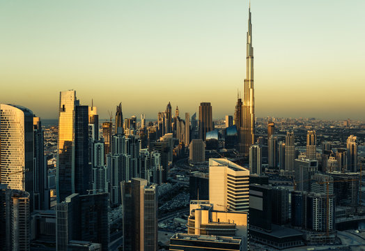Downtown Dubai with skyscrapers. Aerial view over the famous architecture of Dubai at sunset.