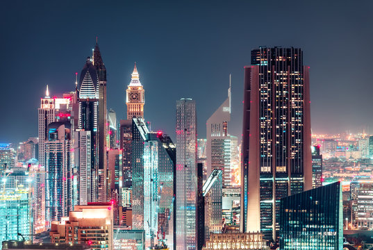 Modern city architecture by night. Business bay, Dubai, United Arab Emirates. Travel background.
