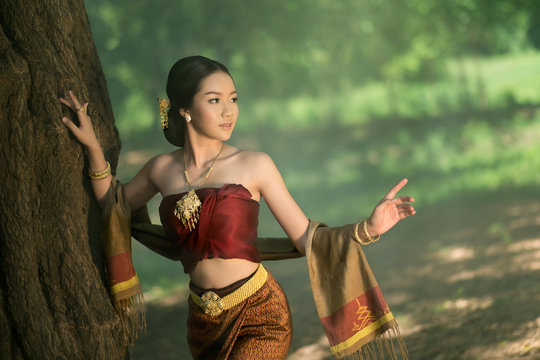 Thai woman in tradition silk dress.Asia beautiful custom.