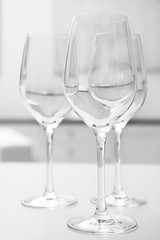 Wineglasses on blurred interior background