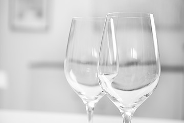 Wineglasses on blurred interior background