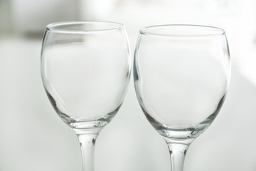Wineglasses on blurred interior background
