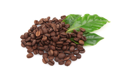 Coffee beans and green leaves, isolated on white