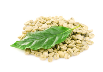 Coffee beans and green leaves, isolated on white