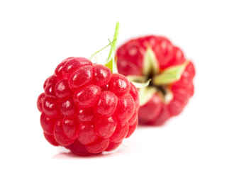 ripe raspberries on white background. Red juicy berries closeup.