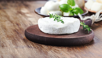 Italian tomino cheese,mozzarella,parmesan on a wooden  board.