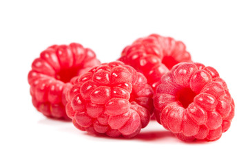 ripe raspberries on white background. Red juicy berries closeup.