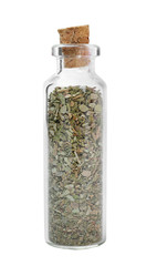 Dried oregano in glass bottle on white background