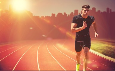 Composite image of athletic man jogging against white background - Powered by Adobe