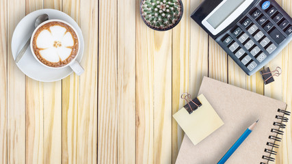 Fototapeta premium cactus, calculator, vintage book, clip, blue pencil and latte co