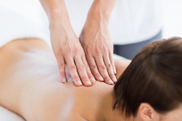 Fototapeta na wymiar Naked woman enjoying back massage