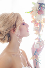 Fototapeta premium Beautiful, sensual bride in a white dress flowers