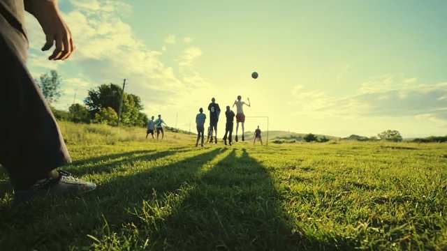 Penalties on the pitch. Rural white football young boys. Slow motion.