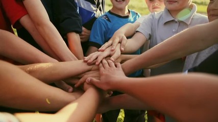 Group of young people's hands. Slwow motion.