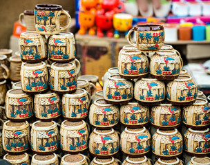 Fototapeta na wymiar Ceramic cups on sale at market, India