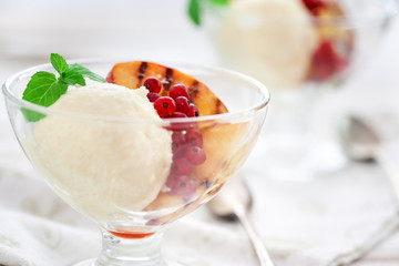 Homemade Peach Ice Cream with currant and mint