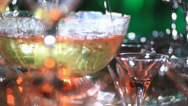 Stylish luxury decorated tables for the celebration for a wedding of happy couple, cathering in the restaurant. Close-up of chamagne fountain