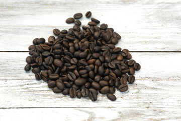 Coffee beans on wood background