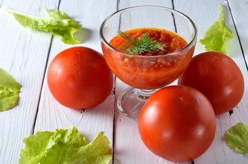 Fresh vegetables for tomato sauce, tomatoes and greens.