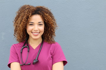 Friendly nurse with stethoscope isolated on blue background