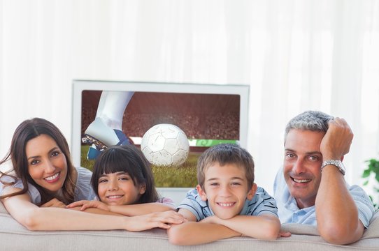 Composite Image Of Family In Sitting Room Smiling At Camera