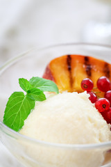 Homemade Peach Ice Cream with currant and mint