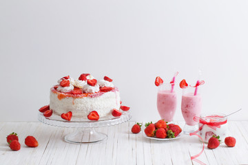 cake with strawberries on wooden table