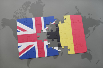 puzzle with the national flag of great britain and belgium on a world map background
