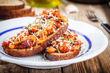 baked beans with rosemary and parmesan on toast