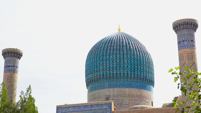 Beautiful view of the ancient Shah-i-Zinda complex  on a sunny summer day  in Samarkand, Uzbekistan.  