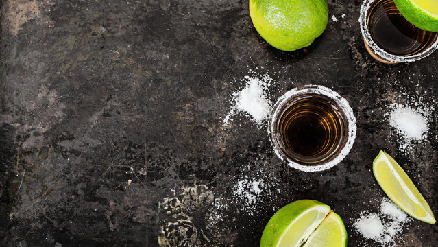 Tequila shots with lime slice, top view