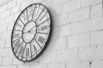 A wall clock on rock wallpaper background