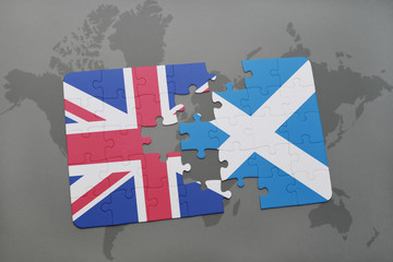 puzzle with the national flag of great britain and scotland on a world map background © luzitanija