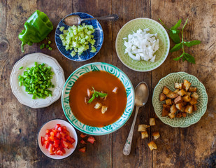 Gazpacho cold Spanish soup prepared the authentic way with garnishes served separately. Rustic...