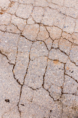 cracks in the old pavement as a background