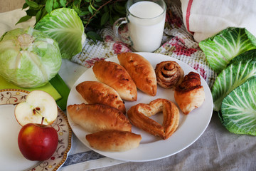 pies cabbage and jug of milk still life with a birch cut, apptitnaya home cooking