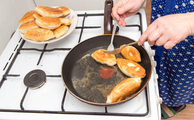 Food patties in a frying pan