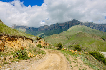 Fototapeta na wymiar Dirt road in the Caucasus mountains