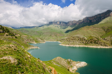 Naklejka na ściany i meble Idyllic summer landscape with clear mountain lake in the Caucasus