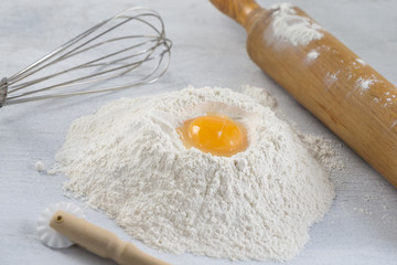 eggs, flour, butter and kitchen utensils