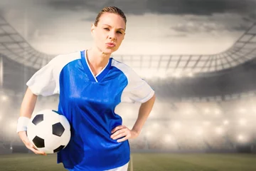 Foto op Canvas Composite image of portrait of woman football player is posing  © vectorfusionart