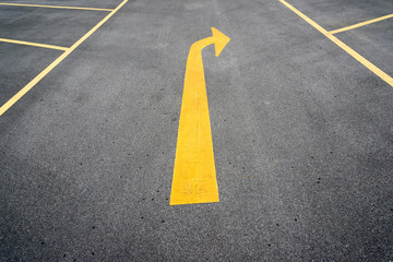 Arrows on asphalt road showing turn right