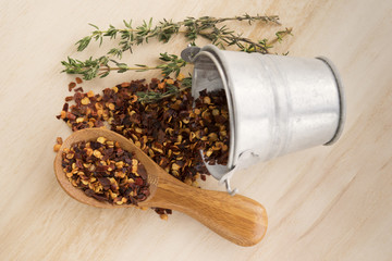 Metal bucket and spilled pepper