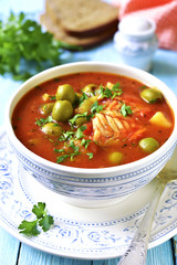 Tomato soup with cod,potato and olives.