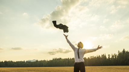 Happy Successful Businessman Throwing His Coat in the Air